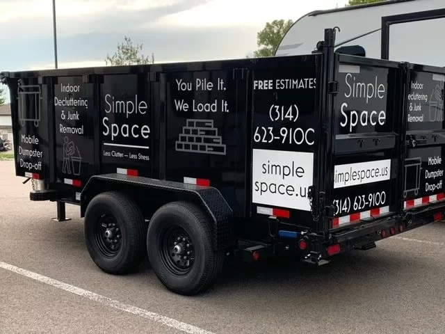 hauling dumpster in lot